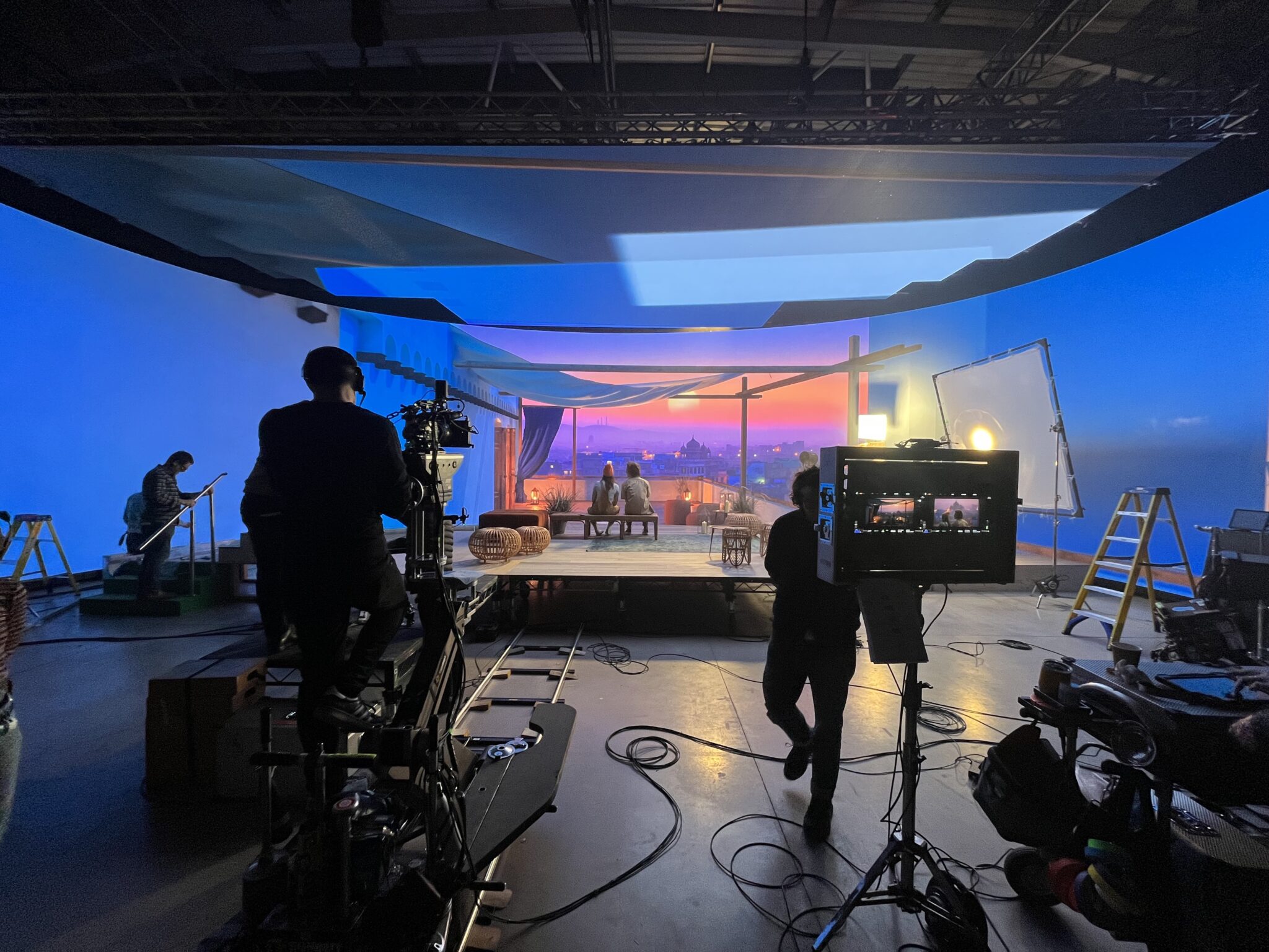 Virtual production crew shooting on LED volume stage